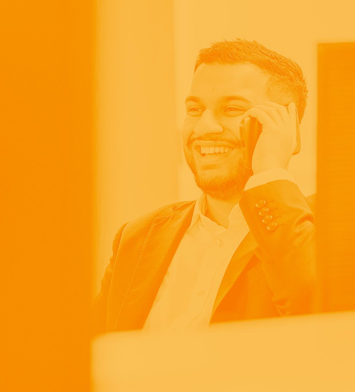 Team member of Ennogen featured in new brand style imagery with an orange filter, part of the digital agency's creative content.